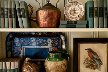 Copper pot on kitchen shelf