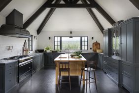 Kitchen with dark wooden floors and dark cabinets