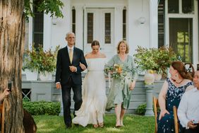 wedding processional bride being accompanied by parents