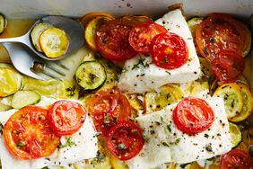 baked fish with summer squash topped with sliced tomatoes