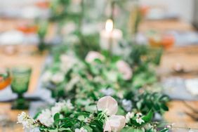 cascading centerpiece with candles and greenery