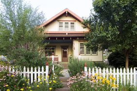 Bungalow House with White Picket Fence