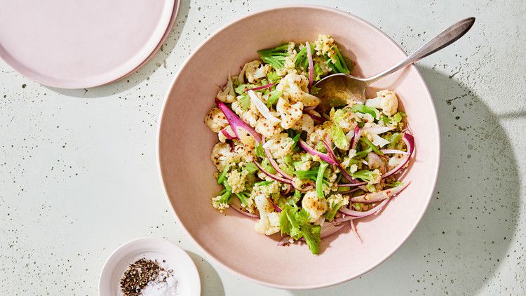 cauliflower faux-tato salad served in a pink bowl