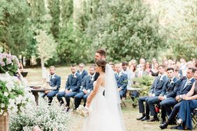 bride and groom standing outdoor wedding ceremony