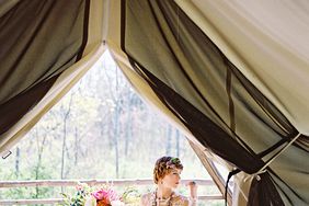 bride in firelight camps tent in new york