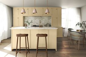 Spacious kitchen with marble backsplash. 