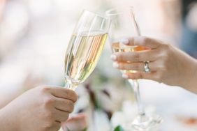 Guests Clinking Champagne Flutes During Toast