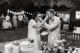 bride and groom cake sharing at reception