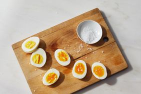 instant hard boiled eggs halved on wood cutting board