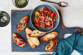 Marinated Peppers With Mint and Sesame on blue cutting board