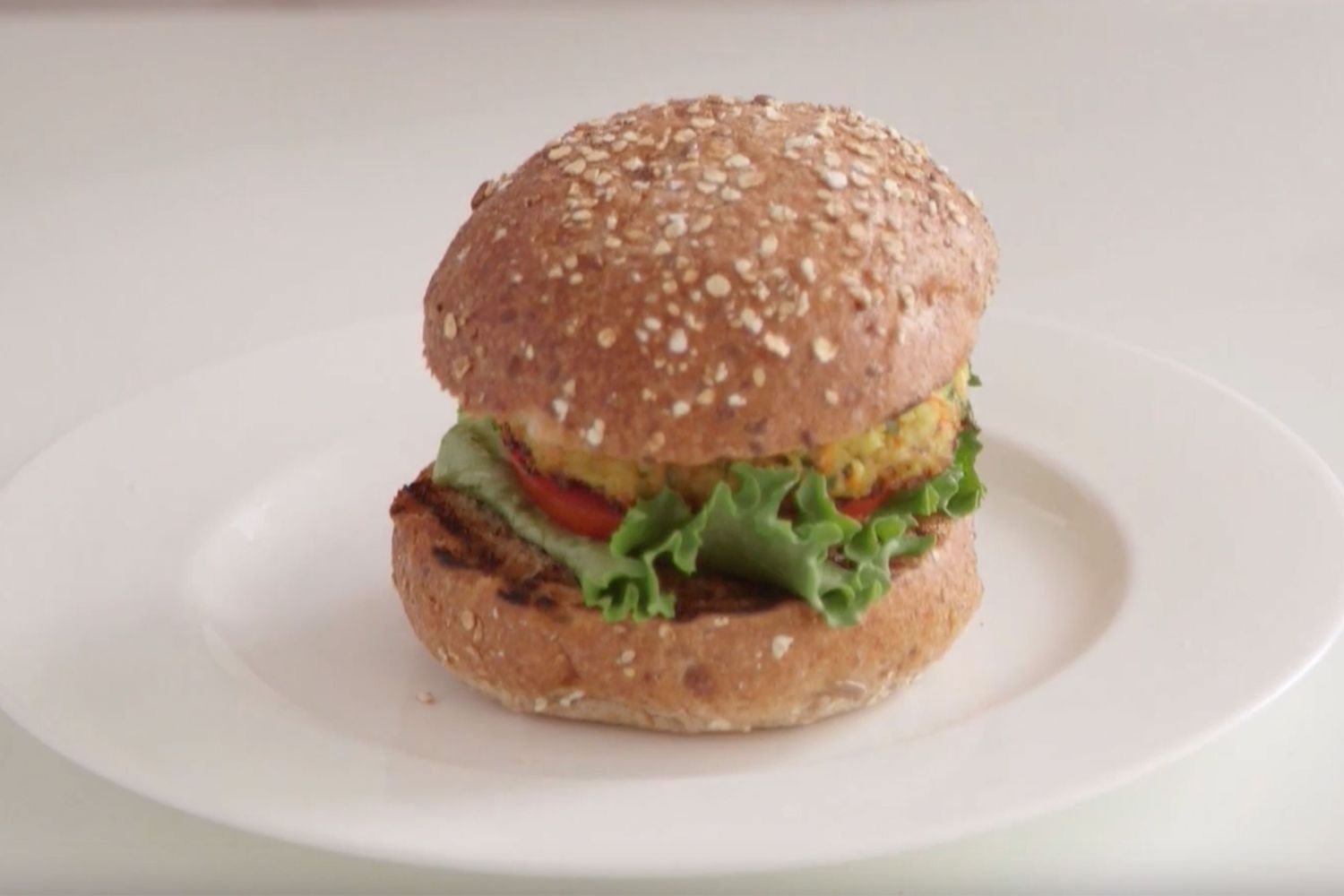 Millet vegetable burger on white plate