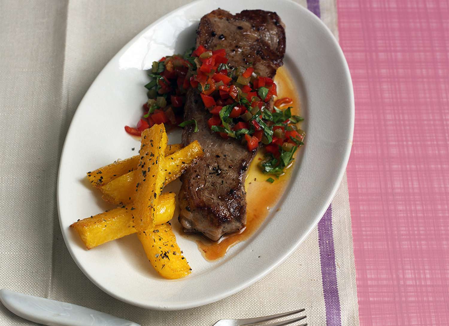 Pan-Fried Shell Steak on a white plate