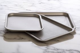 Three baking sheets on counter