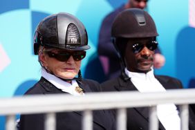 Snoop Dogg and Martha Stewart watching the Dressage Team Grand Prix Special at the Chateau de Versailles on the eighth day of the 2024 Paris Olympic Games in France. Picture date: Saturday August 3, 2024. (Photo by Mike Egerton/PA Images via Getty Images)