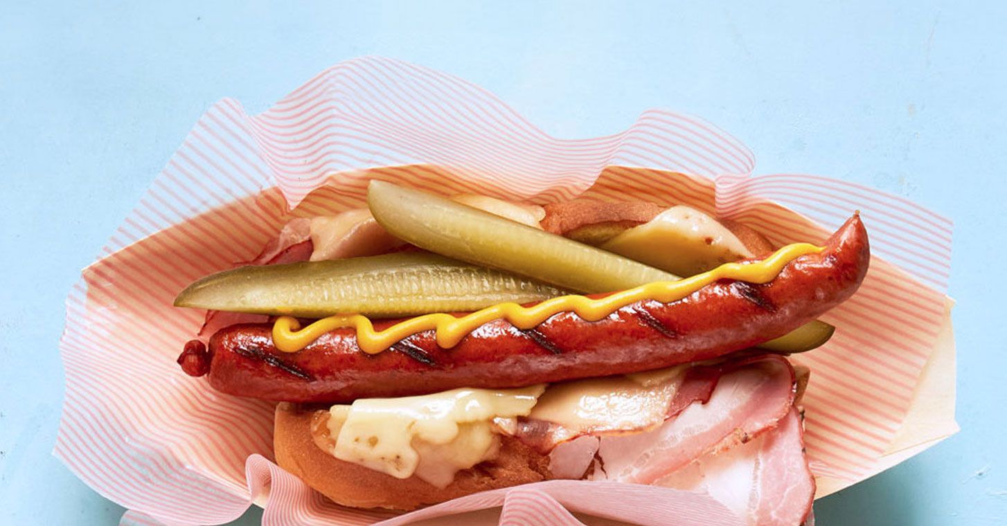 Hot dog with pickles and cheese