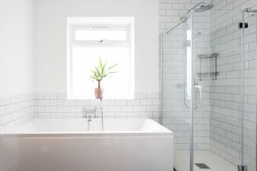 Clean white tiled bathroom