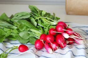 Bunch of radishes on dish towel