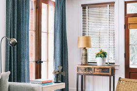 Living room with blue curtains and blinds