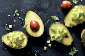 overhead view of halved avocados with chopped melon