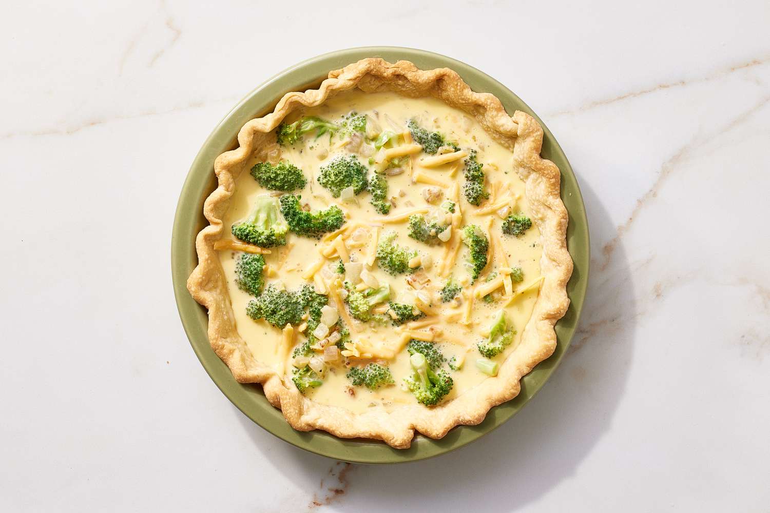 Pour broccoli cheddar mixture into pie and bake