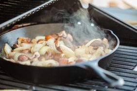 Grilled mushrooms and onions in cast iron frying pan