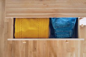 neatly folded clothes in dresser