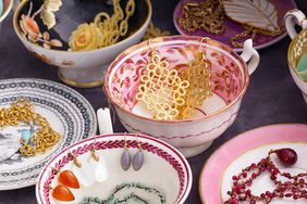 Tea cups in a drawer holding jewelry