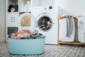 Laundry room with clothes