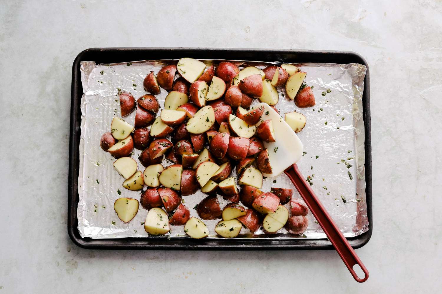 roasted red potatoes - adding oil and herbs