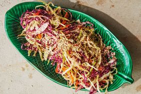 shredded cabbage with ginger vinaigrette topped with sesame seeds