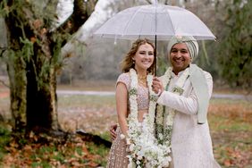 ellie and kalyn wedding couple under umbrella outside