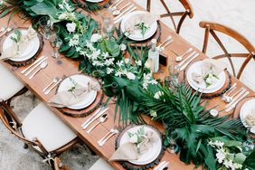 tropical wedding table setting palm leaves